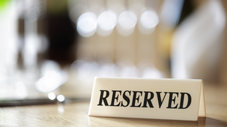 Restaurant table with "reserved" sign