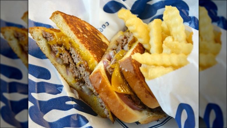 A sourdough melt and fries on a tray at Culver's restaurant.