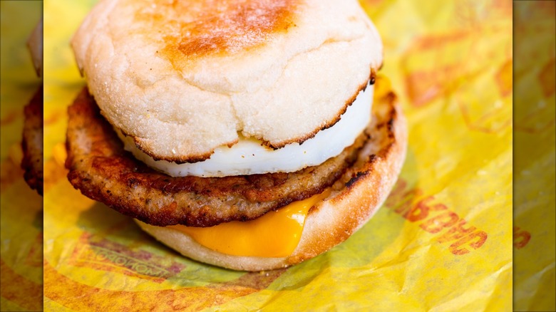 An unwrapped sausage McMuffin from McDonald's.