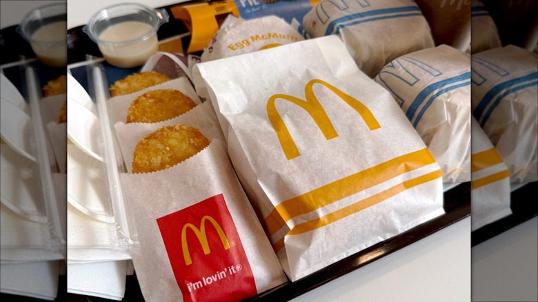 McDonald's hashbrowns and sandwiches on tray at the restaurant.