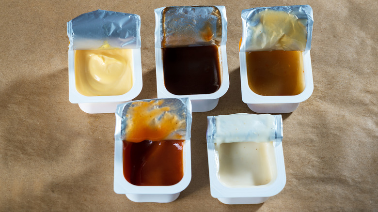 Open fast food sauce packets