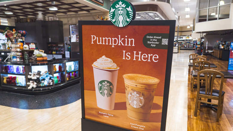 Sign advertising the return of Starbucks' pumpkin-flavored beverages.