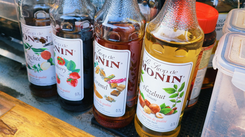 Bottles of flavored syrups lined up