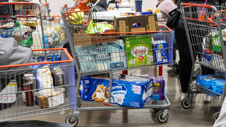 Shopping carts at Costco packed with groceries