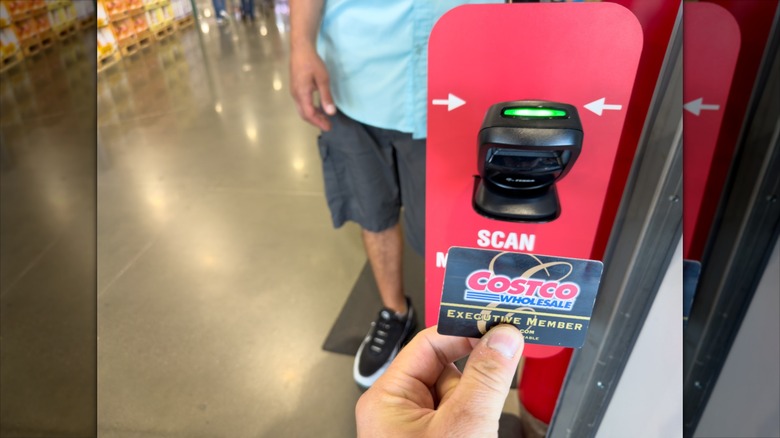 Person scanning membership card at Costco
