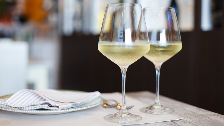 Two glasses of white wine at a restaurant