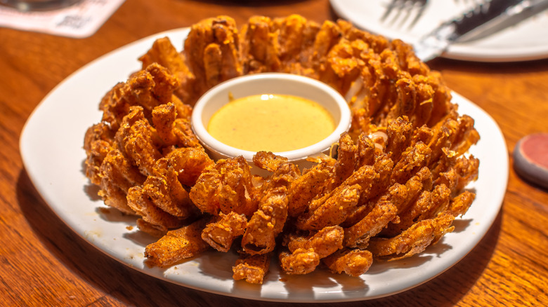 blooming onion appetizer on table at restaurant