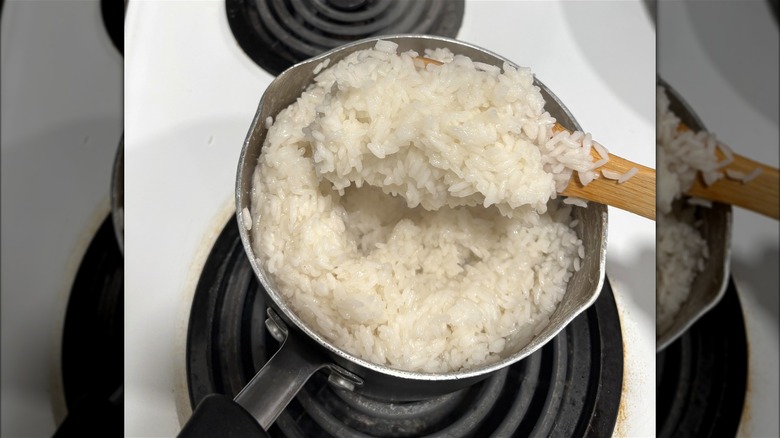 A pot of undercooked rice with a sticky exterior but hard interior.