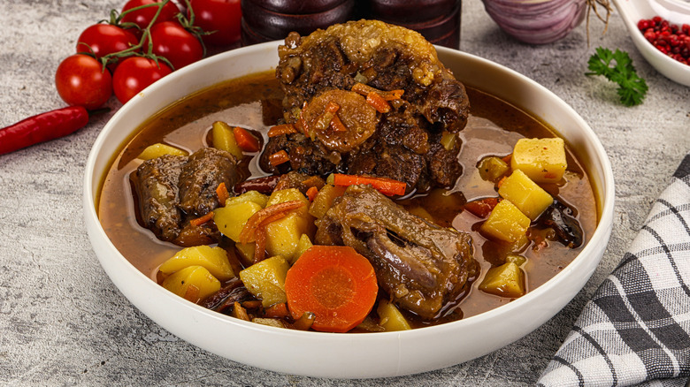 Oxtail soup with potatoes and carrots
