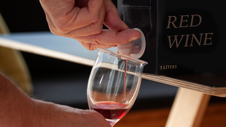Pouring wine from a box