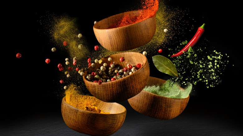 Spices in the air with black background
