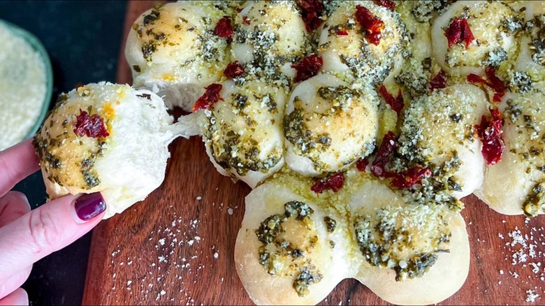 Bread balls with cheese, pesto, and sundried tomatoes