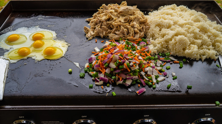 Eggs, chicken, vegetables, and rice on Blackstone griddle.
