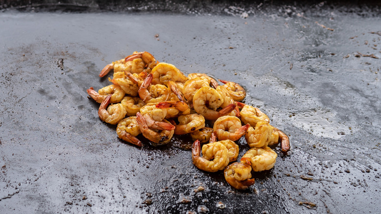 Grilled shrimp on a black Blackstone griddle flat-top