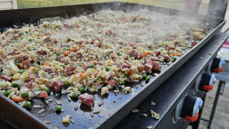 Large batch of fried rice on Blackstone griddle.