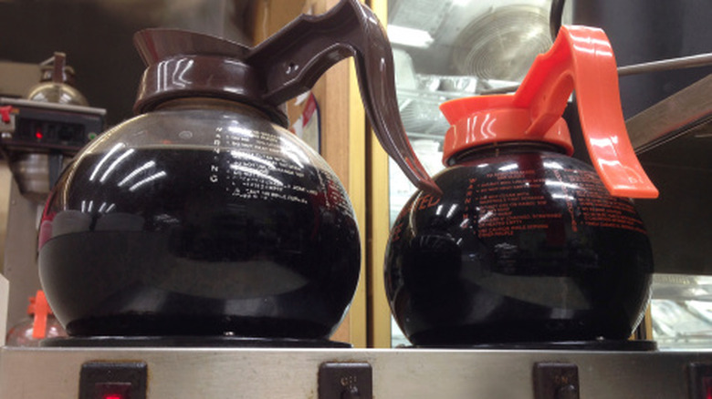 Restaurant-style drip coffee pot full of coffee