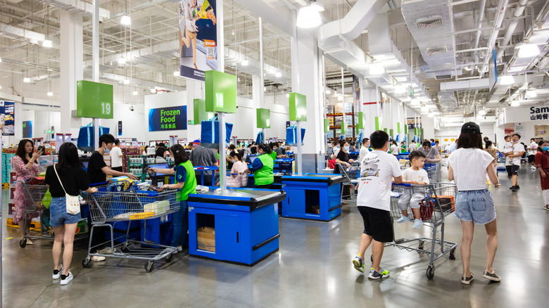 Shoppers in Sam's Club checkout area.
