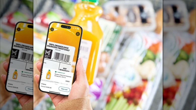 Person scanning bottle of orange juice with smartphone app.