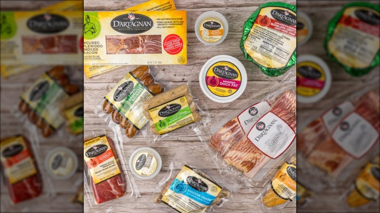 assortment of charcuterie products on wood table