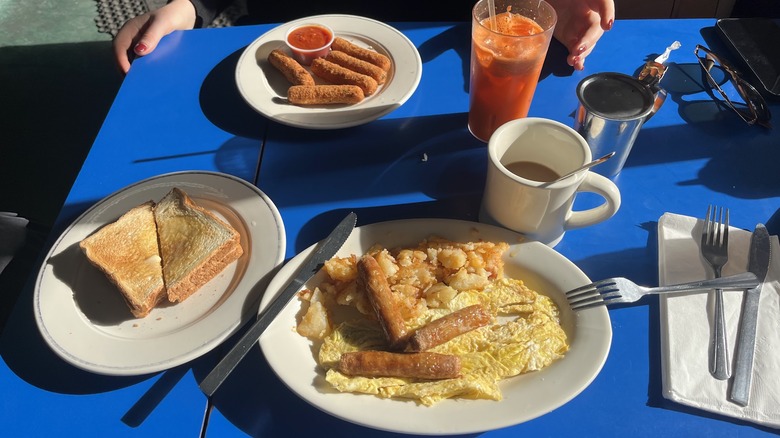 Spread of diner food on a blue table at Landmark Diner