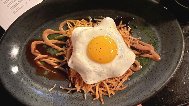 Roasted Pig Face dish with fried egg on top