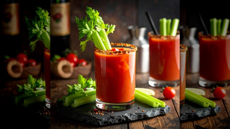 A bloody mary cocktail in a stout glass with a celery garnish.