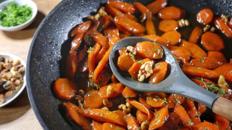Bourbon glazed carrots in wok