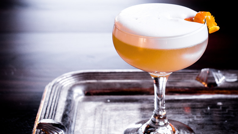 Classic whiskey sour in a coup