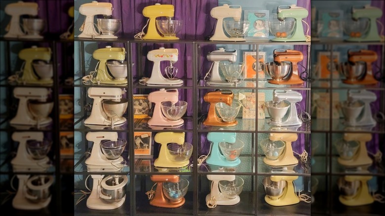 Display of various vintage KitchenAid mixers