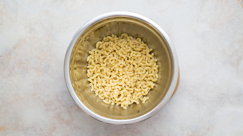 cooked pasta in metal bowl
