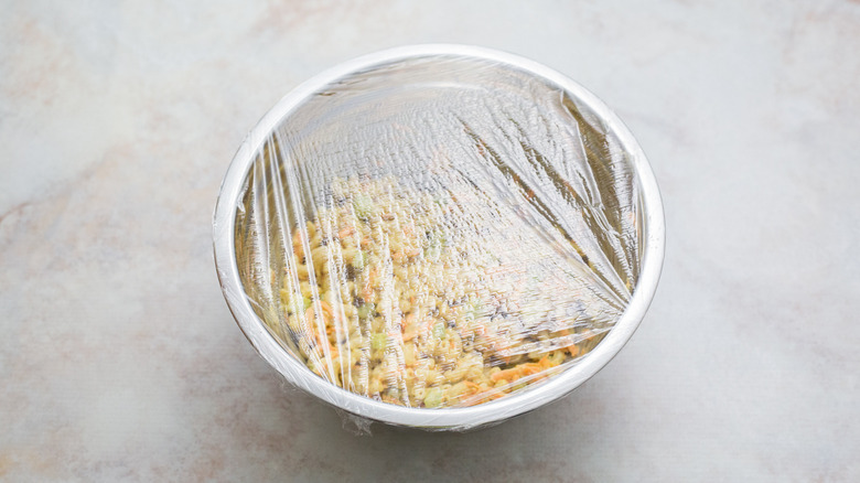 macaroni salad in covered bowl