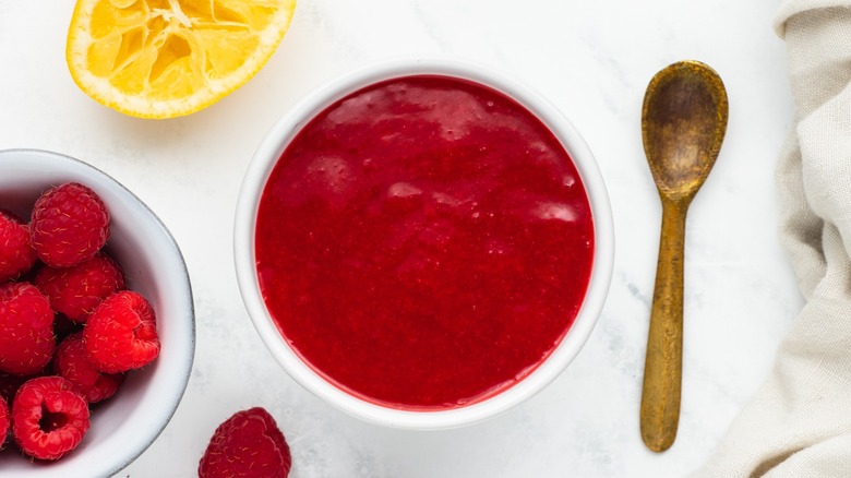strained raspberry sauce in bowl