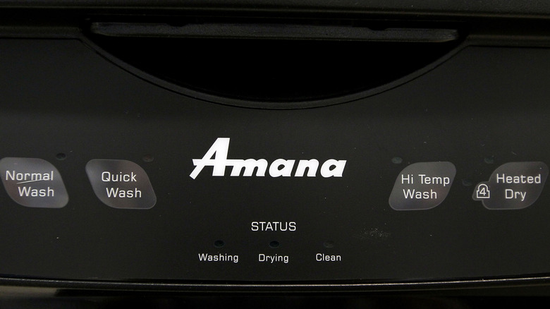 Closeup of the front of a black Amana dishwasher control panel