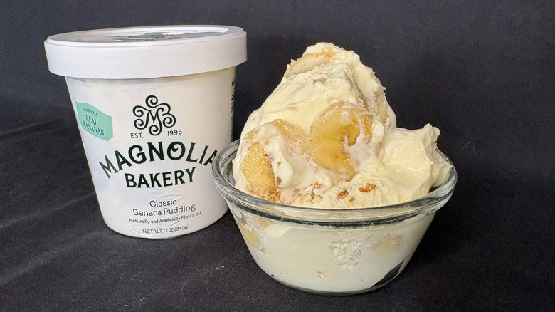 Magnolia Bakery banana pudding container next to cup with pudding