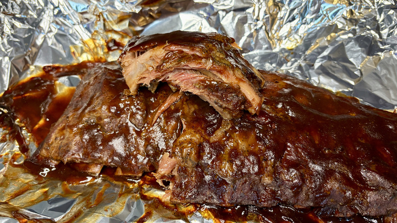 Cooked Burgers' Smokehouse ribs on foil pan