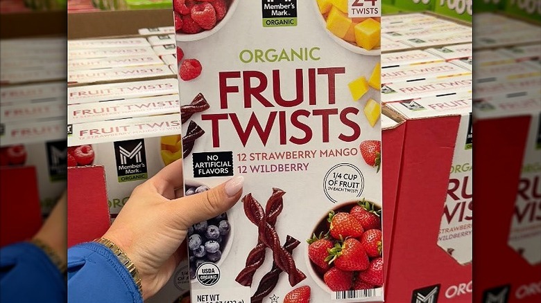 A box of Organic Fruit Twists at Sam's Club against the backdrop of many boxes of them.