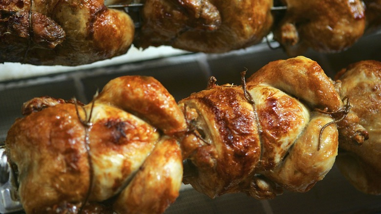 Rotisserie chickens cooking