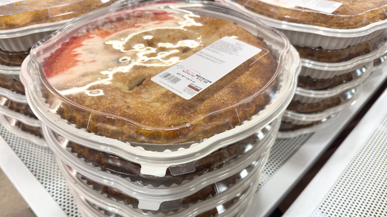 Closeup of a Kirkland Signature apple pie label placed on top of plastic pie shell covering
