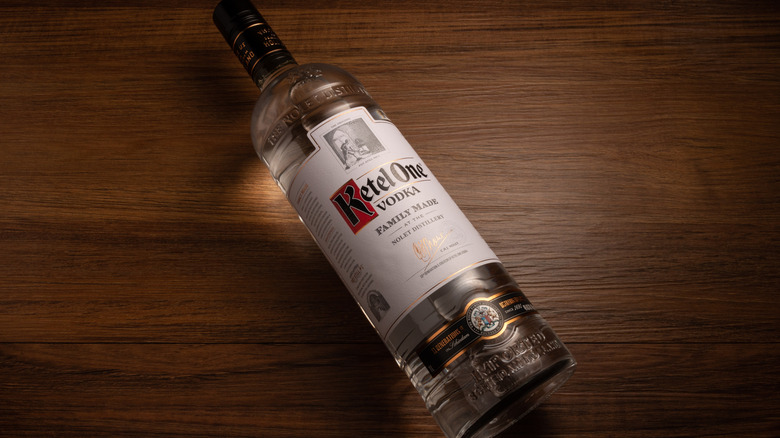 Bottle of Ketel One vodka on wooden table