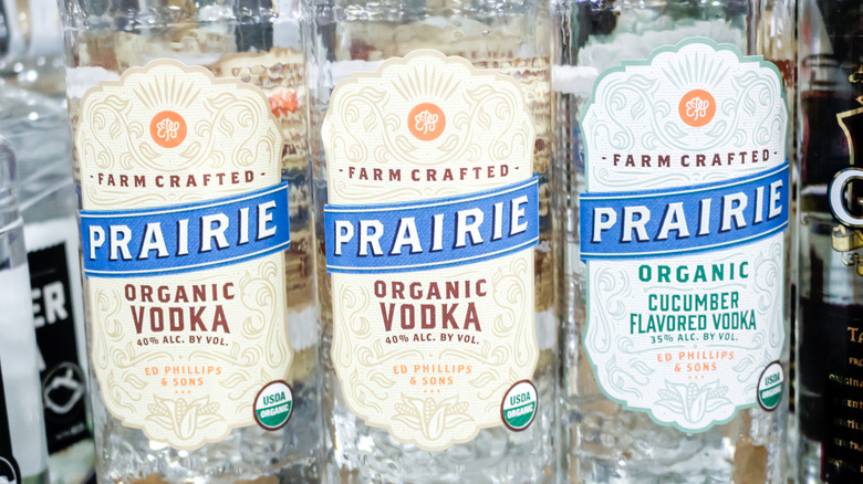 Closeup of two bottles of regular Prairie Organic Vodka and one bottle of cucumber Prairie Organic Vodka