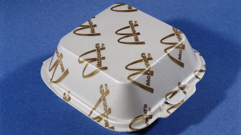 1990s styrofoam packaging for a McDonald's burger on a blue background