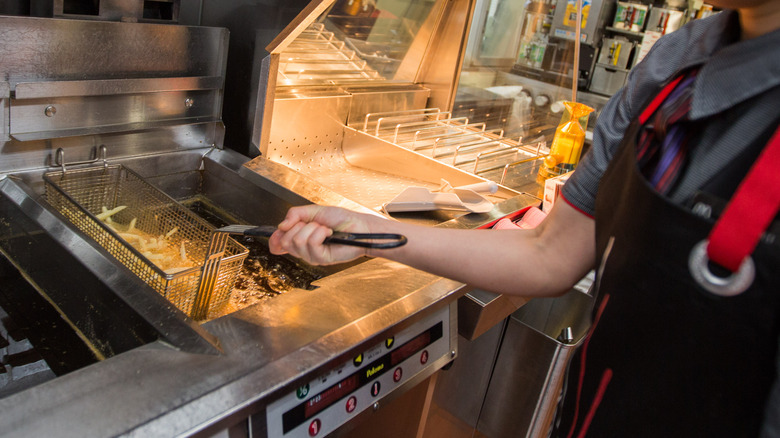 McDonald's worker making French fries