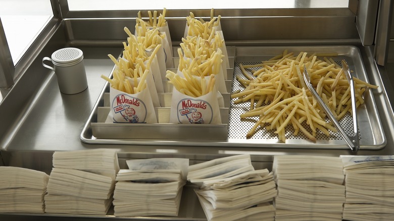 McDonald's fries in old fashioned bags waiting to be served