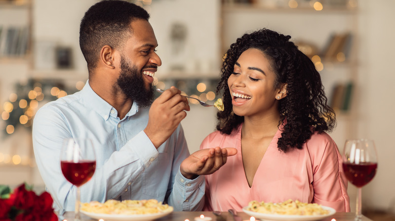 couple eating Valentine's Day meal at home