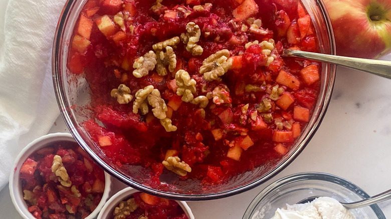 Bowl of Jell-O salad with apples and walnuts.