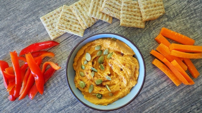 Pumpkin hummus, crackers, and vegetables