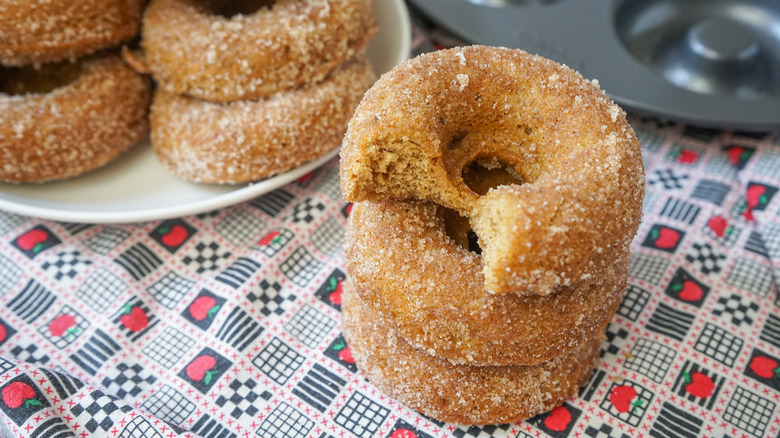 Apple cider donuts on tablecloth