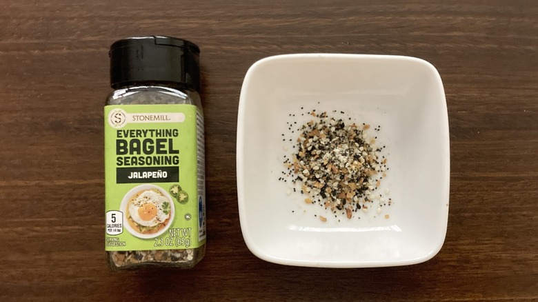 Stonemill Jalapeño Everything Bagel Seasoning in a small dish, next to the jar