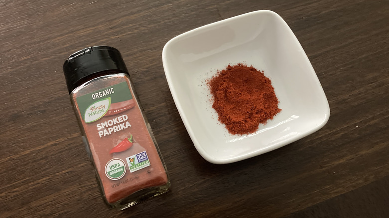 Aldi brand Simply Nature Smoked Paprika in a small dish, next to the jar