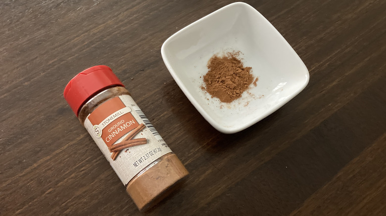 Stonemill ground cinnamon in a small dish, next to the jar
